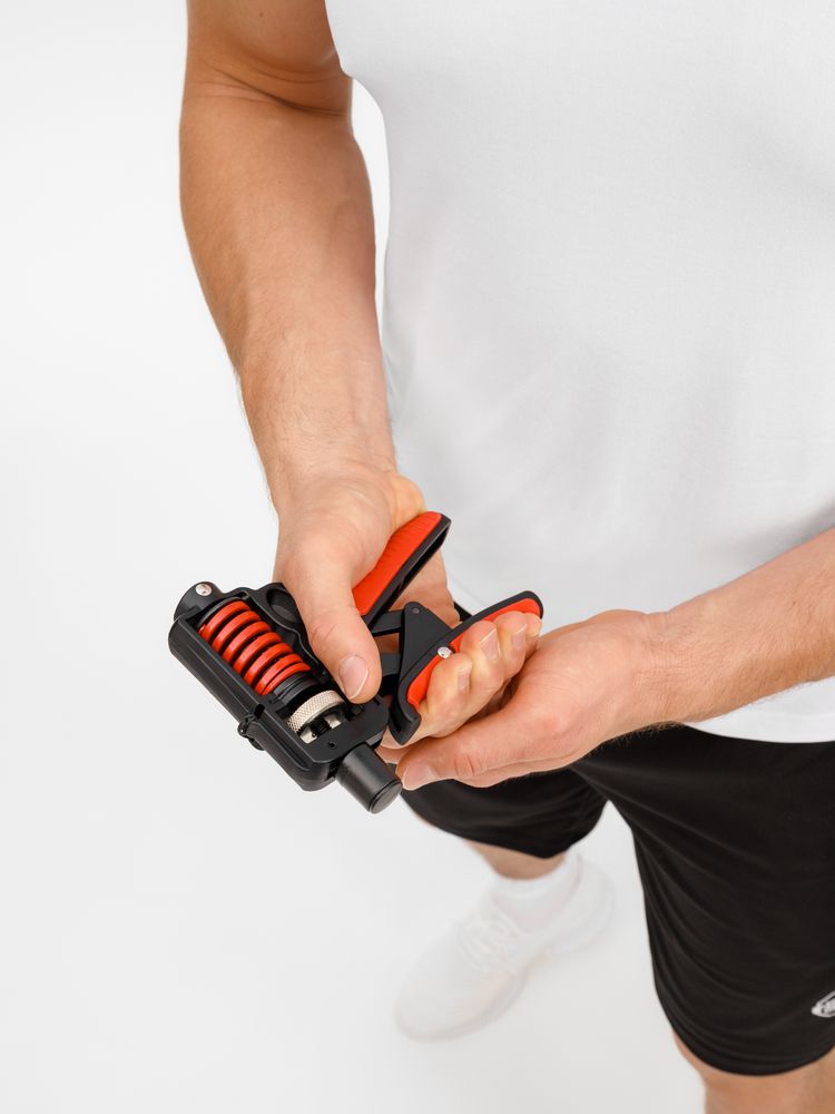 Эспандер кистевой пружинный Motive Power, черный с красным / Миниатюра модельного (1000)